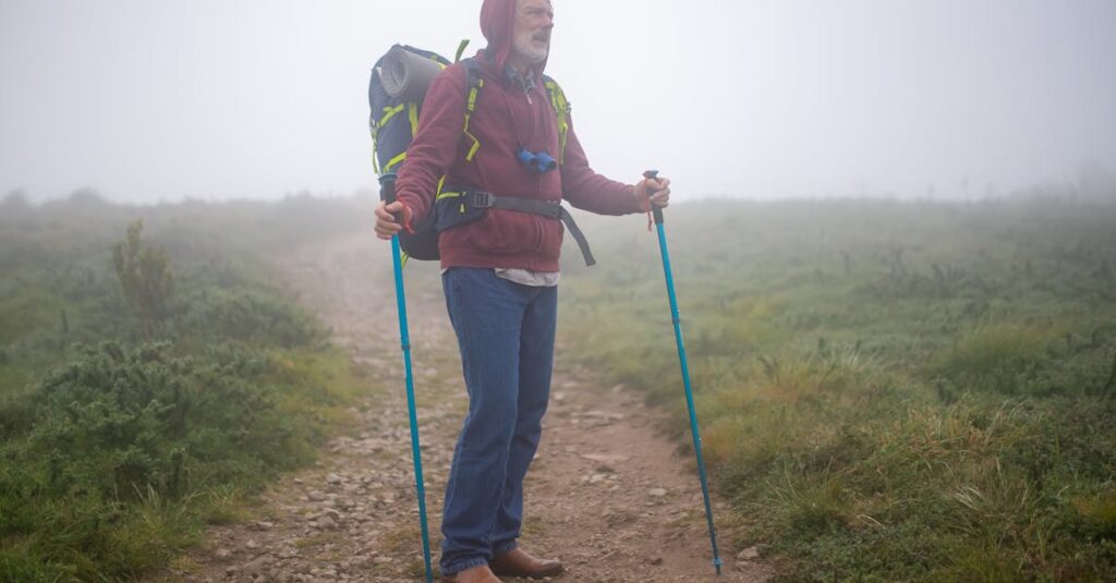 pexels-photo-7787474-7787474 Senior man hiking on a foggy trail in Portugal, enjoying the outdoors and leisure trekking.
