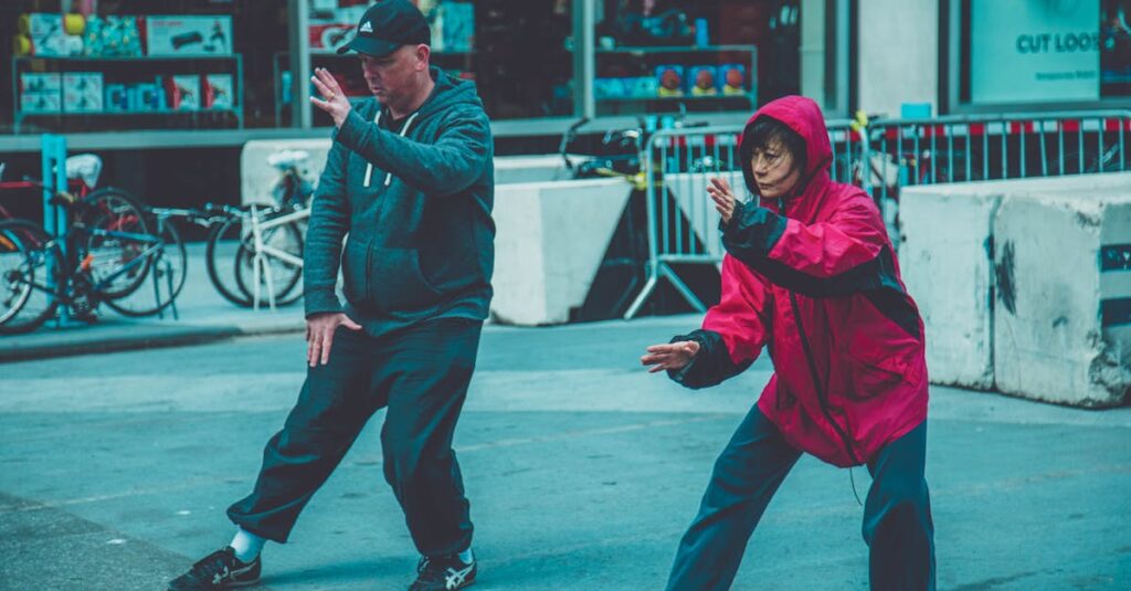 pexels-photo-1543932-1543932 Two adults practicing martial arts on the street, showcasing fitness and focus in an urban environment.