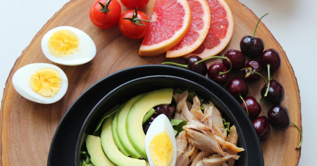 pexels-photo-793759-793759 A vibrant, healthy salad bowl with avocado, eggs, tomatoes, grapefruit, and cherries on a wooden board.