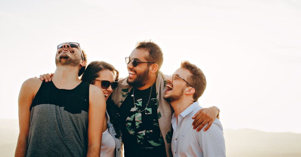 pexels-photo-708440-708440 A group of young adults laughing and enjoying time together outdoors under the sun.